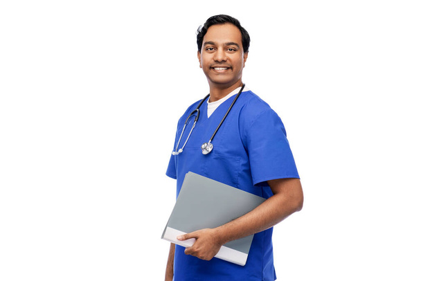 happy indian doctor with folder and stethoscope - Фото, зображення