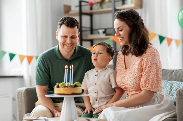happy family with birthday cake at home - Photo, Image