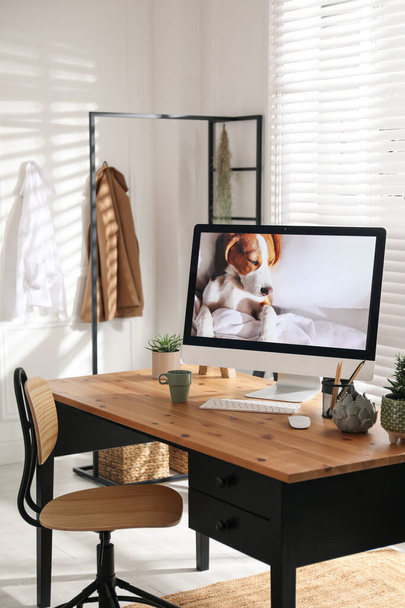 Stylish home office interior with comfortable workplace - Foto, Imagen