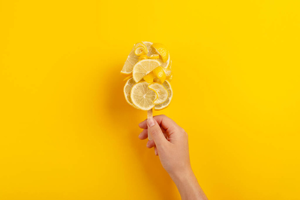 Creative ice cream made from lemon. Refreshing bright summer dessert concept - Photo, Image