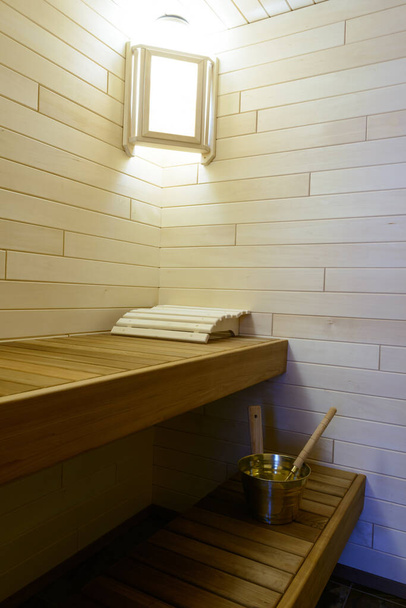 wooden sauna interior with shelf and accessories - Foto, Imagem