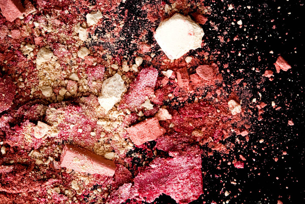 Crushed cosmetics, mineral organic eyeshadow, blush and cosmetic powder isolated on black background, makeup and beauty banner, flatlay design - Photo, Image
