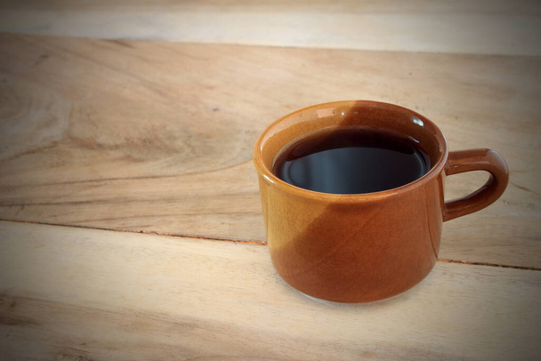 Coffee cup on wooden table background - Fotoğraf, Görsel