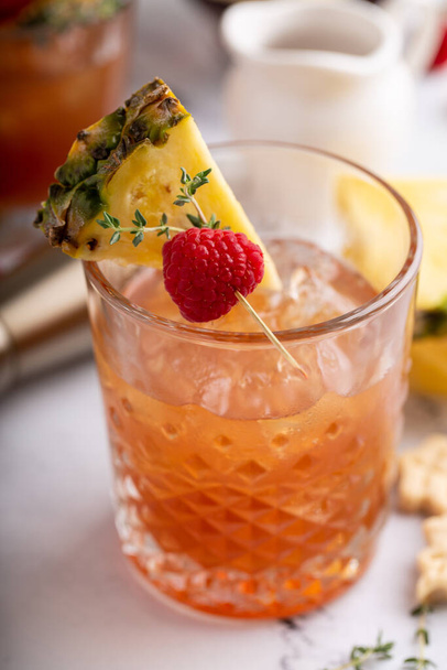 Raspberry pineapple refreshing cocktail with thyme sprig - Foto, imagen