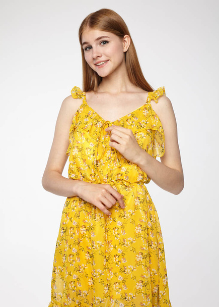 portrait of a beautiful girl in a yellow summer dress - Photo, Image