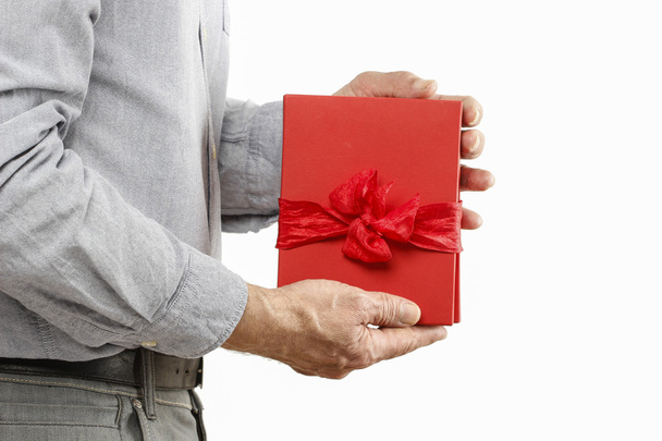 Man gives a book as a present - Foto, Imagen