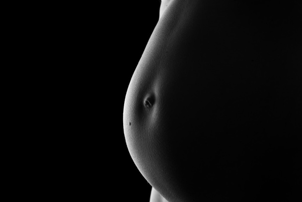 Vientre de una mujer muy embarazada
 - Foto, imagen