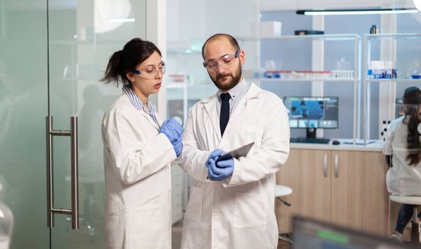 Team of medical scientists conducting vaccine development - Photo, Image