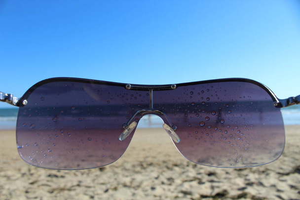 glasses in beach close up - Photo, Image