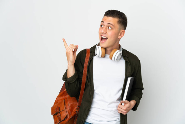 Young caucasian student man isolated on white background intending to realizes the solution while lifting a finger up - Photo, Image