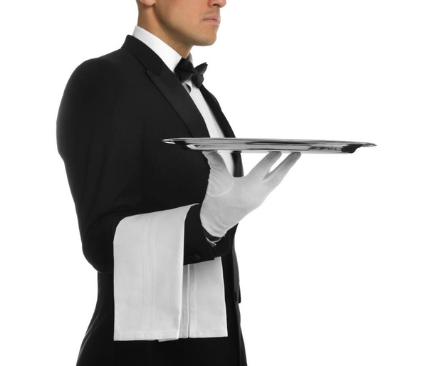 Elegant butler holding silver tray isolated on white, closeup - 写真・画像