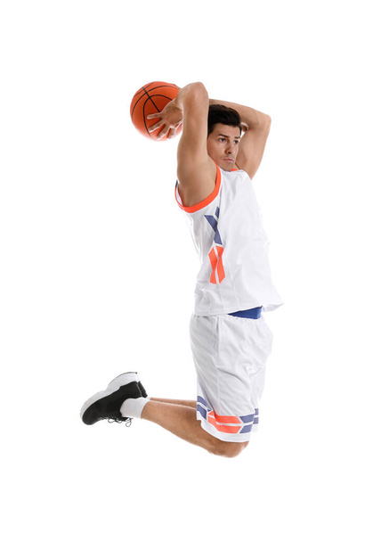 Professional sportsman playing basketball on white background - Фото, изображение