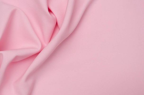 Smooth elegant pink tissue abstract background. Textile background. Cloth wallpaper. Graphics design element - Foto, Imagem