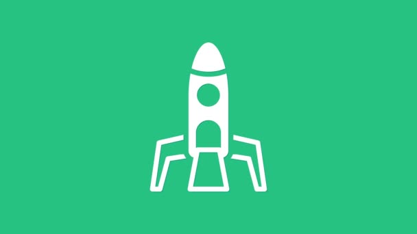 Fehér Rakéta ikon elszigetelt zöld háttérrel. Űrutazás. 4K Videó mozgás grafikus animáció - Felvétel, videó