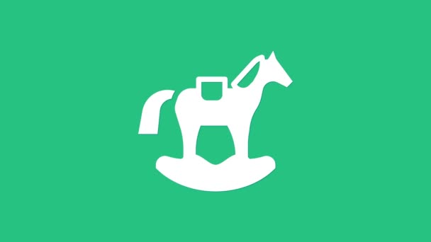 White Wooden horse in saddle swing for little children icon isolated on green background. 4K Video motion graphic animation - Filmati, video