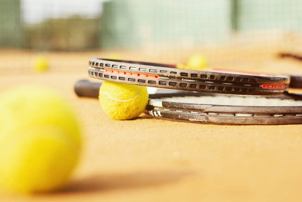 A closeup shot of tennis balls on the tennis court - Фото, изображение