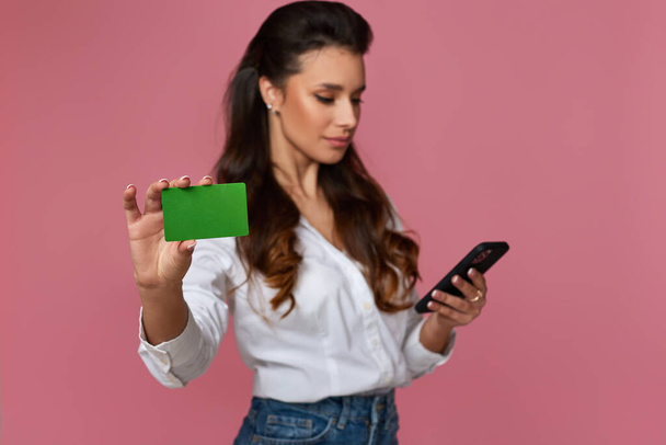 woman holding bag, credit bank card and mobile phone - Photo, image