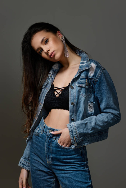 beautiful fashionable young woman in jeans posing - Photo, image