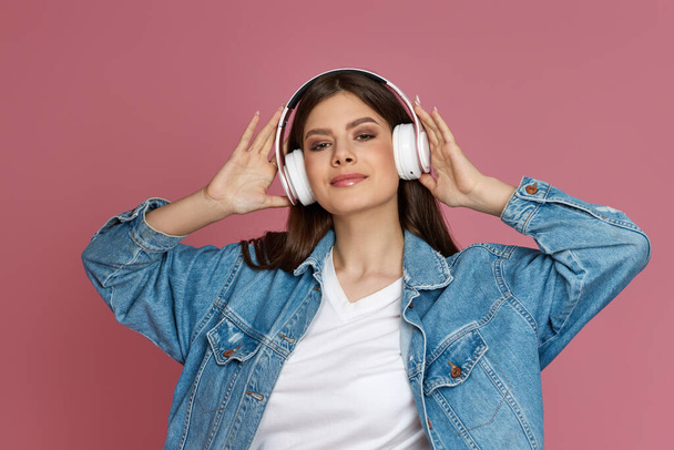 beautiful woman in headphones listening to music - Fotó, kép