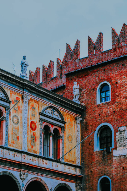 A vertical shot of colorful old vintage buildings - Фото, изображение