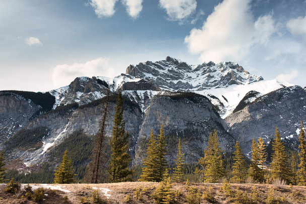 A low angle shot of snow-covered Mount Rundle in Banff National Park, Canada - Zdjęcie, obraz
