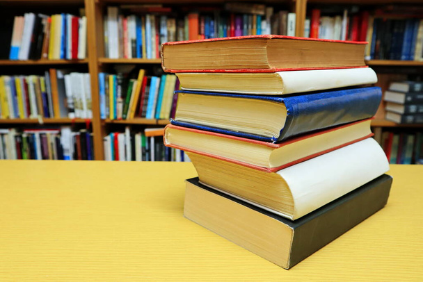 Books on the table in library - Photo, Image