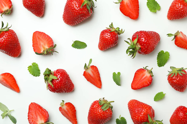 Fresh tasty strawberry with leaves on white background - 写真・画像
