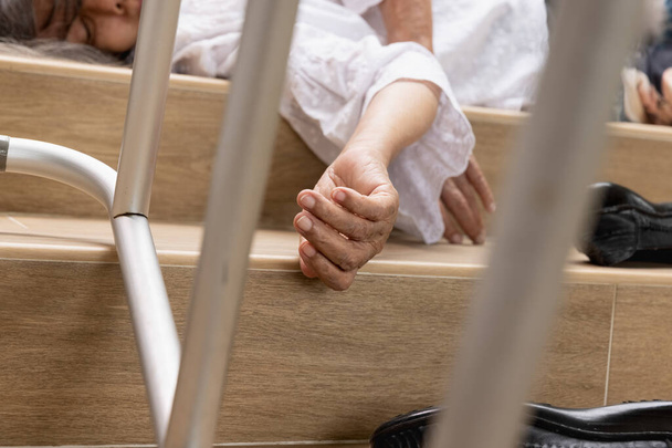 Elderly woman with walker falling down stair - Photo, Image