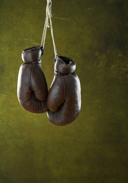 Old boxing gloves hanging on a wall - Photo, Image