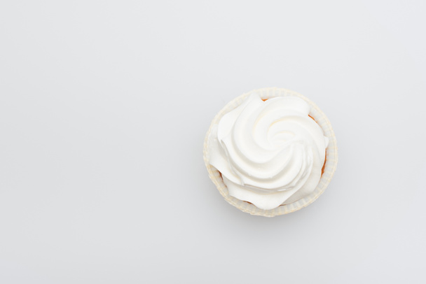 top view of sweet cupcake with icing on top isolated on white - Foto, immagini