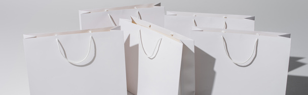 shopping bags with purchases on white background, banner - Photo, Image
