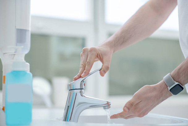 Close up picture of doctor washing his hands before surgery - Foto, Bild