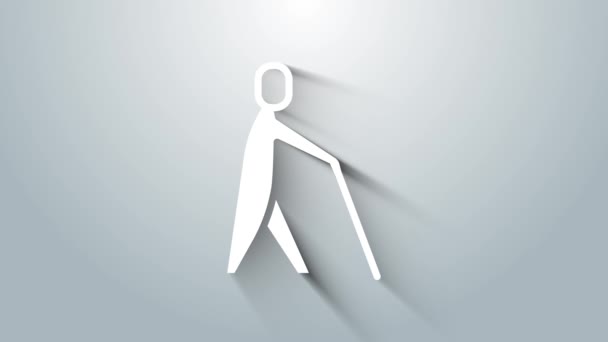 Fehér Vak ember kezében bot ikon elszigetelt szürke háttérrel. Fogyatékkal élő ember vaksággal. 4K Videó mozgás grafikus animáció - Felvétel, videó