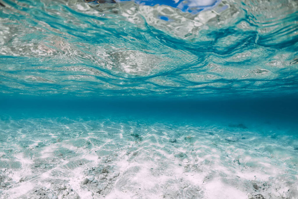 Underwater ocean with sand and little stones in Hawaii. Water background - Fotografie, Obrázek