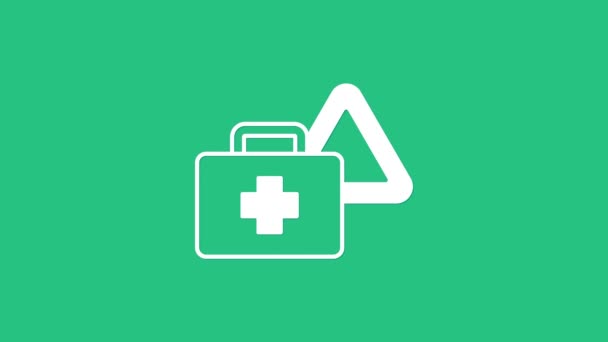 White First aid kit and warning triangle icon isolated on green background. Must be in the car. 4K Video motion graphic animation - Filmagem, Vídeo