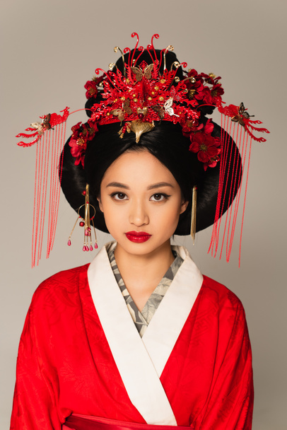 Young japanese woman with traditional hairdo isolated on grey  - Fotografie, Obrázek
