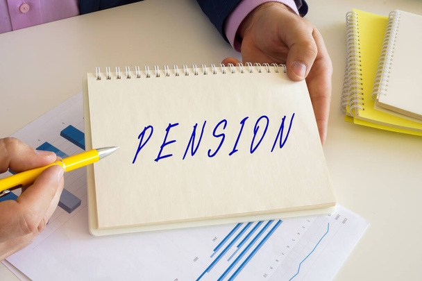 Financial concept about PENSION with inscription on the writing-pad. - Fotoğraf, Görsel