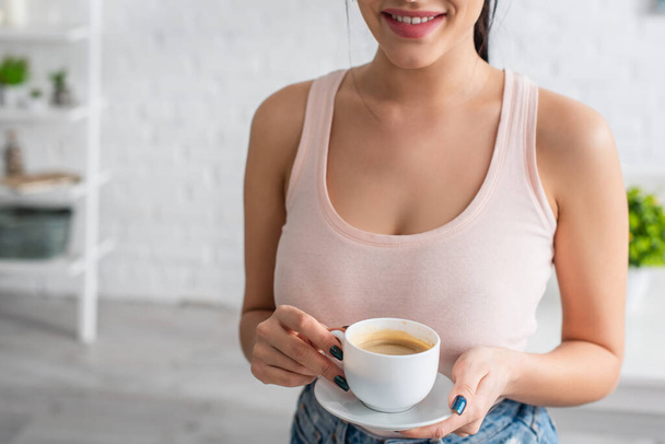 partial view of young woman holding cup of coffee  - Foto, Imagen