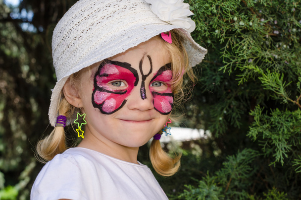 child with face painting - Foto, afbeelding