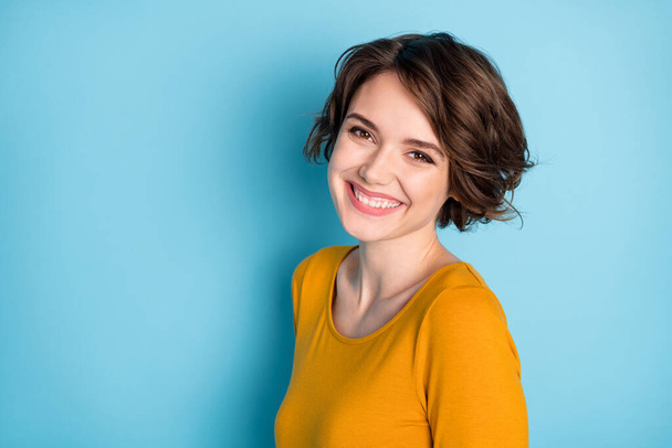 Photo of young beautiful lovely happy cheerful positive girl wear yellow sweater isolated on blue color background - Φωτογραφία, εικόνα