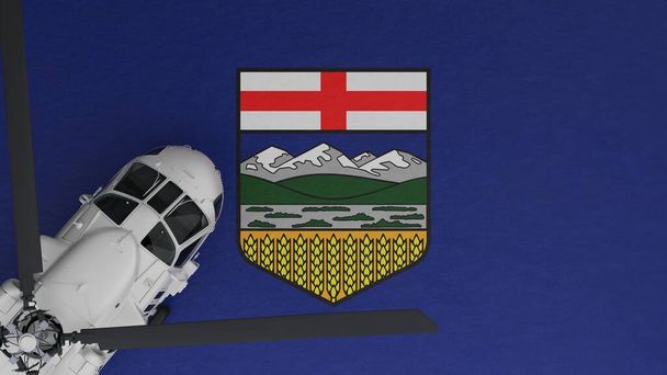 Vista de arriba hacia abajo de un helicóptero blanco en la esquina inferior izquierda y en la parte superior de la bandera de Alberta - Foto, imagen