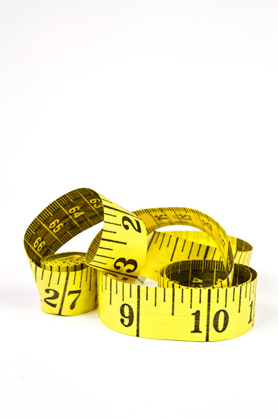 Измерительная лента с применением при пошиве в желтом и бланке
 - Фото, изображение