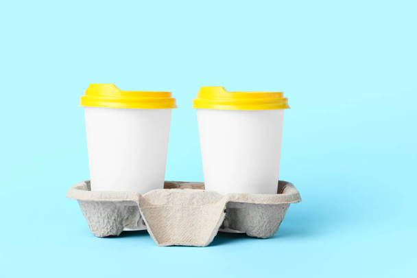 Takeaway cups for coffee on color background - Фото, зображення