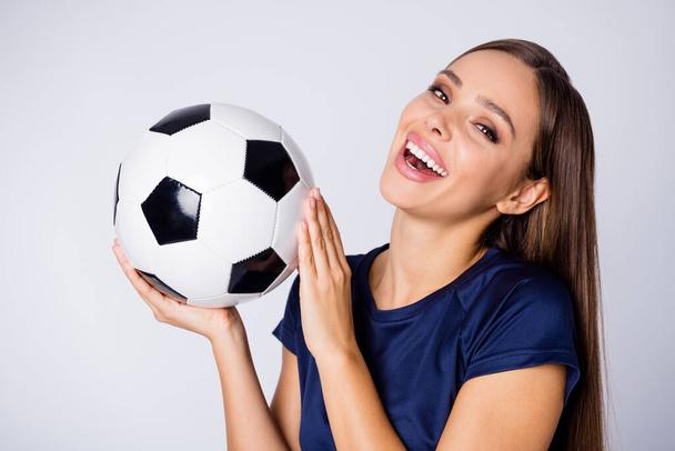 Close-up portrait of nice-looking attractive lovely lovable sweet charming fascinating cheery straight-haired girl holding in hand ball having fun isolated on light white gray pastel color background - Foto, Imagen