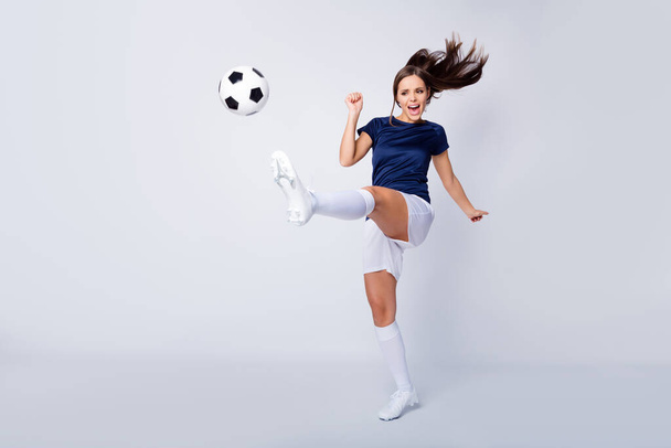 Full length body size view of her she nice-looking attractive lovely pretty focused purposeful straight-haired girl jumping throwing ball isolated over light white gray pastel color background - 写真・画像
