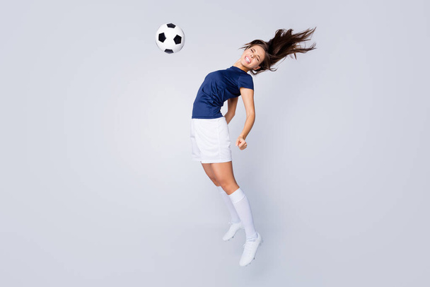 Full length body size view of her she nice attractive lovely graceful motivated sportive purposeful straight-haired girl jumping hitting ball isolated on light white gray pastel color background - Foto, afbeelding
