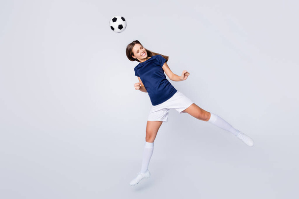 Full length body size view of her she nice attractive lovely motivated sportive addicted straight-haired girl jumping hitting ball having fun hobby isolated on light white gray pastel color background - Φωτογραφία, εικόνα