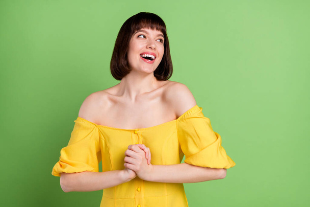 Portrait of attractive cheerful amazed girl having fun good news isolated over green color background - Фото, изображение