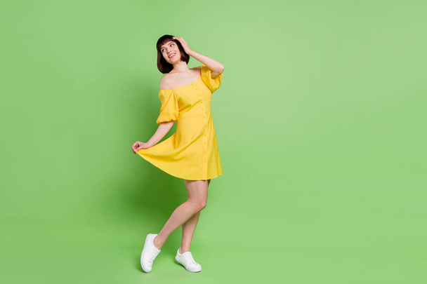 Full length body size view of attractive cheerful girl dancing having fun free time isolated over green color background - Photo, image