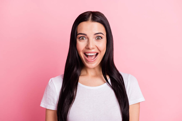 Portrait of charming amazed cheerful long-haired girl great news reaction isolated over pink pastel color background - Fotó, kép